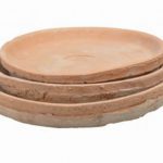 Large round aged terracotta saucer